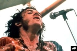 FILE - Joe Cocker performs at Woodstock in Bethel, New York, August 1969.