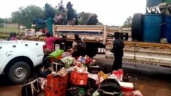 Arrested Gold Panners Unloading Belongings At Gwanda Station