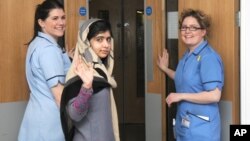 This photo made available by Queen Elizabeth Hospital shows Malala Yousafzai saying goodbye as she is discharged from the hospital to continue her rehabilitation at her family’s temporary home in the area, January 4, 2013.