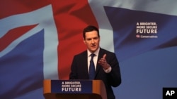 FILE - Britain's treasury chief, George Osborne, is seen speaking to a meeting of Conservative party members in Swindon, England, April 14, 2015. He argues, for Britain to leave the EU, would be “an extraordinary self-inflicted wound."