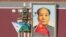 Djibouti and Chinese national flags near the Tiananmen Square portrait of China's late leader Mao Zedong, November 23, 2017. (Jason Lee/Reuters) 