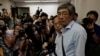 Freed Hong Kong bookseller Lam Wing-kee stands before giving a news conference in Hong Kong, June 16, 2016. Lam detailed his experience in custody in mainland China during his monthslong disappearance.