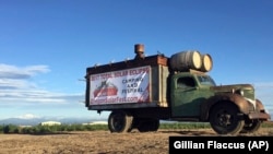 An ad for a festival celebrating the for the Aug. 21 total solar eclipse sits next to a busy road near Madras, Oregon. Up to 1 million people are expected in Oregon and up to 100,000 could show up in Madras. Officials are worried about the ability of the