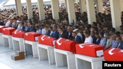 Coffins with victims of the thwarted coup are lined up for a funeral service in Ankara, Turkey, July 17, 2016.