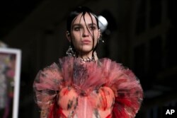 A model wears a creation for Alexander McQueen's Spring-Summer 2018 ready-to-wear fashion collection presented Oct. 2, 2017, in Paris.