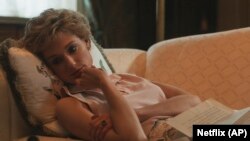 This image released by Netflix shows Elizabeth Debicki as Princess Diana in a scene from "The Crown." (Netflix via AP)