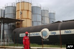 FILE - A worker is seen at the Port Autonome de Pointe Noire, in the Republic of Congo, Dec. 17, 2019.