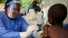 A Ugandan health worker administers ebola vaccine to a child in Kirembo village, near the border with the Democratic Republic of Congo in Kasese district, Uganda June 16, 2019. REUTERS/James Akena