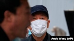 Dans un centre de test de dépistage du coronavirus à Shanghai, en Chine, le 25 octobre 2022.