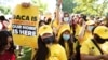 FILE - Susana Lujano, left, who was born in Mexico but lives in Houston, joins other activists to rally in support of the Deferred Action for Childhood Arrivals program, also known as DACA, at the U.S. Capitol in Washington, June 15, 2022.