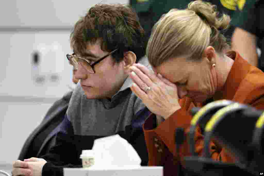 Assistant public defender Melisa McNeill, seated with Marjory Stoneman Douglas High School shooter Nikolas Cruz touches her hands to her head as the last of the 17 verdicts were read in the penalty phase of Cruz&#39;s trial at the Broward County Courthouse in Fort Lauderdale.