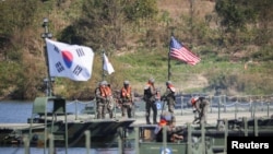 South Korean soldiers take part in a joint river crossing operation drill with U.S. troops in Yeoju, South Korea, Oct. 19, 2022. 