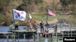 FILE - South Korean soldiers take part in a joint river crossing operation drill with U.S. troops in Yeoju, South Korea, Oct.19, 2022.