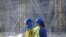 FILE - Workers are seen at the construction site of the Lusail stadium being built for the 2022 FIFA soccer World Cup, in Doha, Qatar, Dec. 20, 2019.
