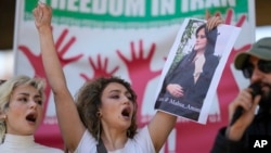 Iranians who live in Brazil protest against the death of Iranian woman Mahsa Amini, who died in Iran while in police custody, in Sao Paulo, Brazil, Sept. 23, 2022.