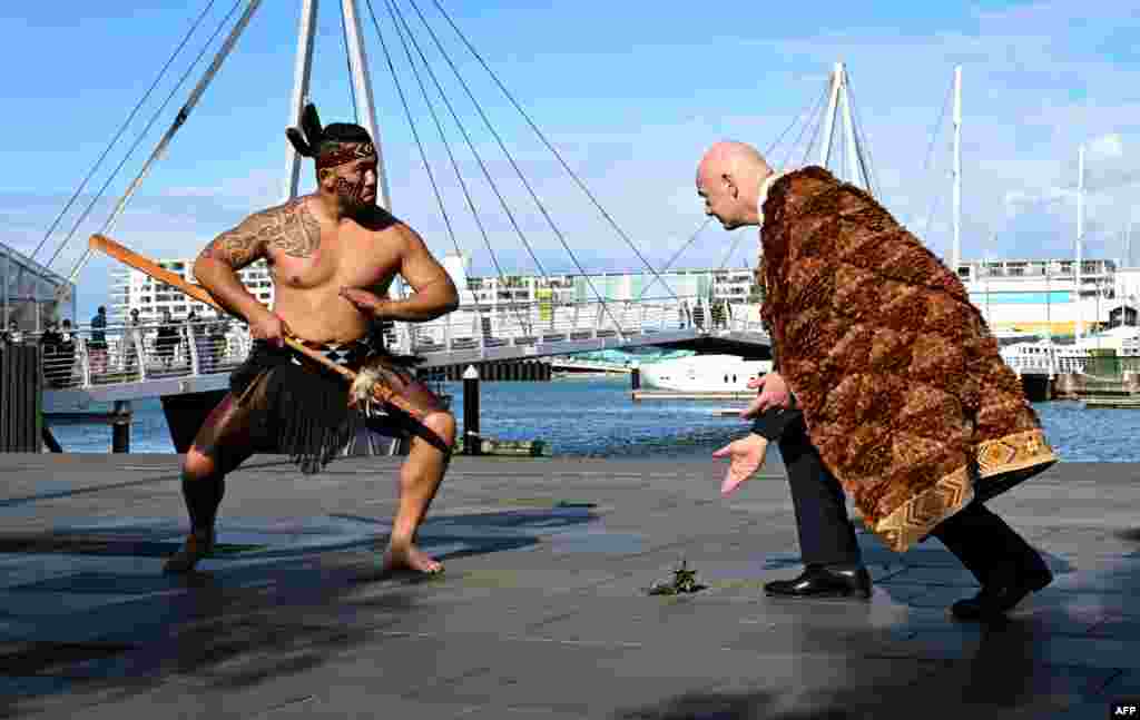 FIFA president Gianni Infantino, right, accepts a Warrior Challenge at an official Maori welcome a day before the football draw ceremony for the Australia and New Zealand 2023 FIFA Women's World Cup, in Auckland.