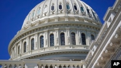 FILE - The sun shines on the U.S. Capitol dome in Washington, Aug. 12, 2022. 