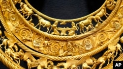 FILE - The fourth century B.C. golden pectoral, an ancient treasure from a Scythian king's burial mound, is exhibited in the Museum of Historical Treasures in Kyiv, Ukraine, on July 30, 2021.