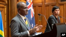 Solomon Islands Foreign Minister Jeremiah Manele, left, and New Zealand Foreign Minister Nanaia Mahuta during their joint media conference at Parliament in Wellington, New Zealand, Tuesday, Oct. 4, 2022. (Mark Mitchell/New Zealand Herald via AP)