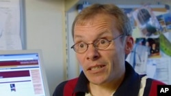 FILE - In this image taken from video, Sean Turnell, an economist at Australia's Macquarie University, speaks during an interview at his university office in Sydney, Nov. 25, 2005. 