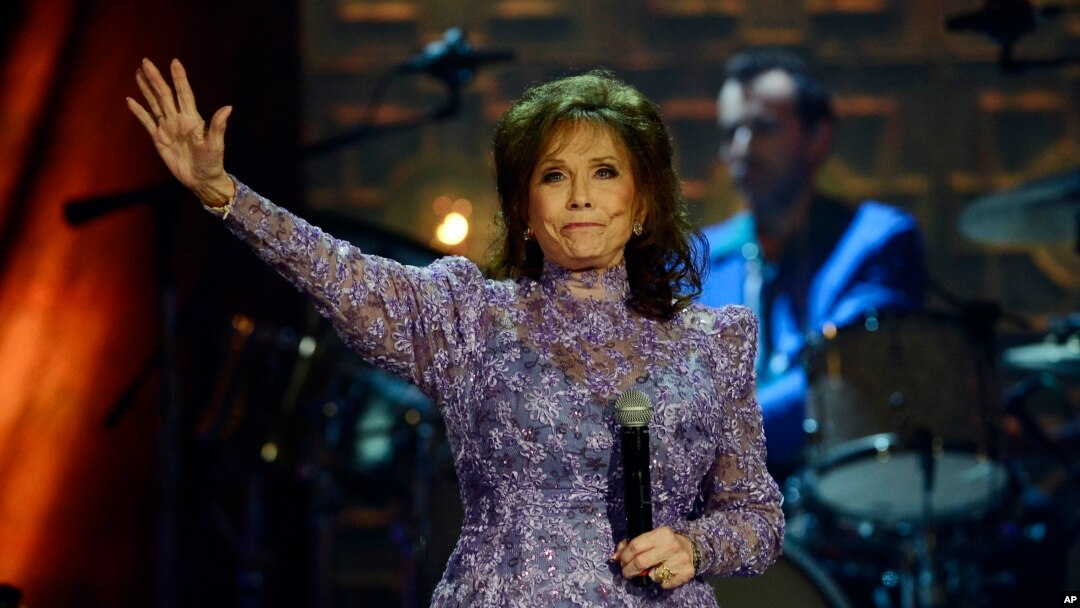 FILE - Loretta Lynn waves to the crowd after performing during the Americana Music Honors and Awards show, Sept. 17, 2014, in Nashville, Tennessee. 