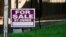 FILE - A 'for sale by owner' sign is displayed outside home in Northbrook, Ill., Sept. 21, 2022. 
