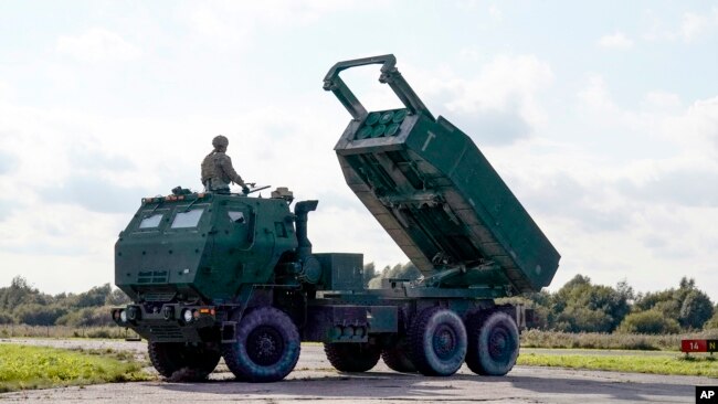 A High-Mobility Artillery Rocket System (HIMARS ) in operation during military exercises at Spilve Airport in Riga, Latvia, Sept. 26, 2022.
