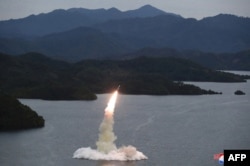 This undated picture released from North Korea's official Korean Central News Agency (KCNA) on Oct. 10, 2022, shows a Hokkaido missile launch training test by the Korean People's Army Tactical Nuclear Operation Unit at an undisclosed location.