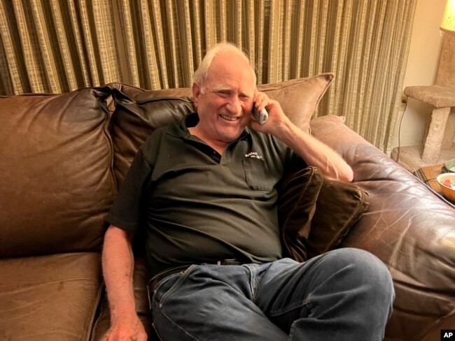 John F. Clauser speaks to reporters on the phone at his home in Walnut Creek, Calif., on Tuesday, Oct. 4, 2022. (AP Photo/Terry Chea)