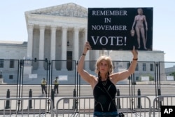 Nicky Sundt, of Washington, protests outside of the Supreme Court, June 29, 2022, in Washington.