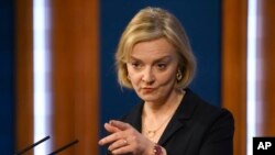 FILE - Britain's Prime Minister Liz Truss attends a news conference in the Downing Street Briefing Room in London, Oct. 14, 2022, following the sacking of the finance minister.
