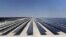 This picture taken on October 18, 2022 shows a view of solar panels at the newly-inaugurated al-Kharsaah solar power plant in Qatar. 