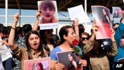 FILE - Protesters gather outside the UN headquarters in Erbil on Sept. 24, 2022, to protest the death of Masha Amini, who had fallen into a coma for three days after being detained by the morality police in Tehran, Iran. 