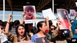 FILE - Protesters gather outside the UN headquarters in Erbil on Sept. 24, 2022, to protest the death of Masha Amini, who had fallen into a coma for three days after being detained by the morality police in Tehran, Iran. 