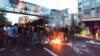 FILE - Demonstrators light a fire during a protest over the death of Mahsa Amini while in custody of Iran's morality police, in Tehran, Sept. 21, 2022. (West Asia News Agency via Reuters)