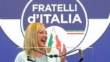 FILE - Brothers of Italy leader Giorgia Meloni speaks to reporters at her party's electoral headquarters in Rome, Sept. 26, 2022.