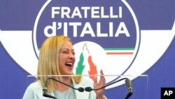 FILE - Brothers of Italy leader Giorgia Meloni speaks to reporters at her party's electoral headquarters in Rome, Sept. 26, 2022.