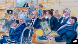 FILE - This artist sketch depicts the trial of Oath Keepers leader Stewart Rhodes, center, and four others charged with seditious conspiracy in the Jan. 6, 2021, Capitol attack, in Washington, Oct. 6, 2022. 