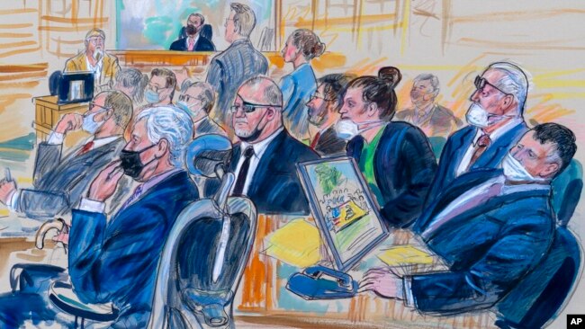 FILE - This artist sketch depicts the trial of Oath Keepers leader Stewart Rhodes, center, and four others charged with seditious conspiracy in the Jan. 6, 2021, Capitol attack, in Washington, Oct. 6, 2022.