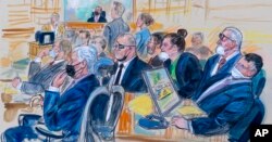 FILE - This artist sketch depicts the trial of Oath Keepers leader Stewart Rhodes, center, and four others charged with seditious conspiracy in the Jan. 6, 2021, Capitol attack, in Washington, Oct. 6, 2022.