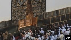 FILE - Muslim pilgrims pray at the Kaaba in the Muslim holy city of Mecca, Saudi Arabia, Sept. 20, 2015. On September 24, 2015, the deadliest disaster in the hajj's history saw occurred when 2,300 pilgrims died in a stampede during a ritual in Mina, near Mecca.