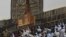 FILE - Muslim pilgrims pray at the Kaaba in the Muslim holy city of Mecca, Saudi Arabia, Sept. 20, 2015. On September 24, 2015, the deadliest disaster in the hajj's history saw occurred when 2,300 pilgrims died in a stampede during a ritual in Mina, near Mecca.