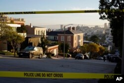 Police tape cordons off a street outside the home of Paul Pelosi and his wife House Speaker Nancy Pelosi, in San Francisco, California, Oct. 28, 2022.