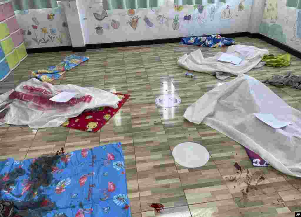 Sheets cover the bodies of young victims at the site of an attack in a day care center in the town of Nongbua Lamphu, north eastern Thailand.&nbsp;A former policeman facing a drug charge burst into the day care center, killing at least 37 people including 22 children. &nbsp;(Mungkorn Sriboonreung Rescue Group via AP)