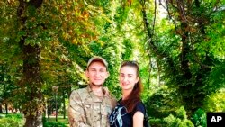 Viktoria Skliar poses for a photo with her boyfriend Oleksii Kisilishin on Aug. 24 2021.