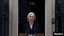 British Prime Minister Liz Truss announces her resignation, outside Number 10 Downing Street, London, Oct. 20, 2022.
