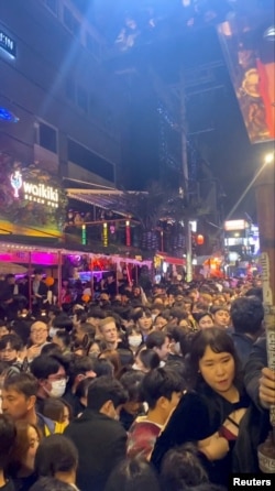 FILE - A dense crowd during a Halloween festival in Seoul, South Korea, Oct. 29, 2022, is seen in this screengrab obtained from a social media video.