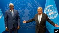 FILE - Chairperson of the African Union Commission Moussa Faki Mahamat, left, meets with United Nations Secretary-General Antonio Guterres at U.N. headquarters, Sept. 18, 2022.