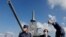 FILE - Japan's Defense Minister Yasukazu Hamada inspects the naval ship Mogami, featuring stealth capability, at the Japan Maritime Self-Defense Force naval base in Yokosuka, Kanagawa Prefecture, Japan, Sept. 5, 2022.