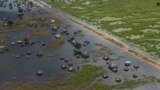 FILE: An aerial view shows flooded homes within a village after the River Nile broke the dykes in Jonglei State, South Sudan. Taken Oct. 5, 2020